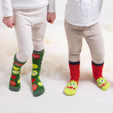 Totes Toasties ORIGINAL Slipper Socks (Twin Pack) Unisex Kids Socks Monster two children wearing colorful monster design socks side view