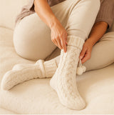 Totes Toasties LUXURY CHUNKY KNIT SLIPPER-SOX WITH TASSEL TRIM Womens Socks Cream, detail view of cozy knit design.
